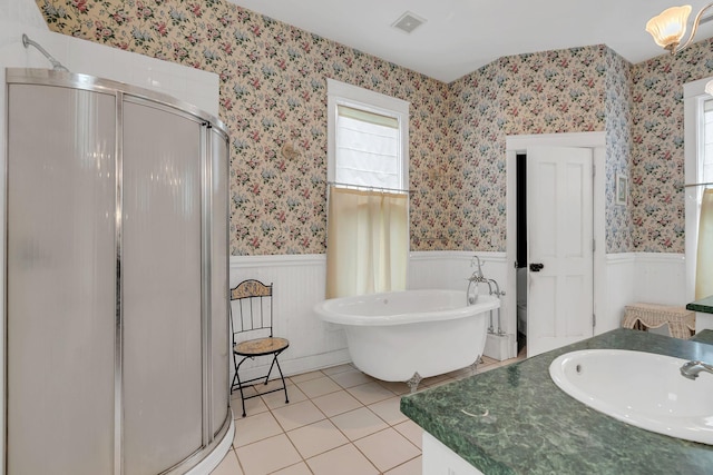 2033 Carters Creek Pike, Franklin, TN 37064 - full bathroom with a wainscoted wall, a shower stall, tile patterned floors, a freestanding bath, and vanity