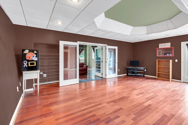 2033 Carters Creek Pike, Franklin, TN 37064 - living room featuring french doors, a paneled ceiling, baseboards, and wood finished floors
