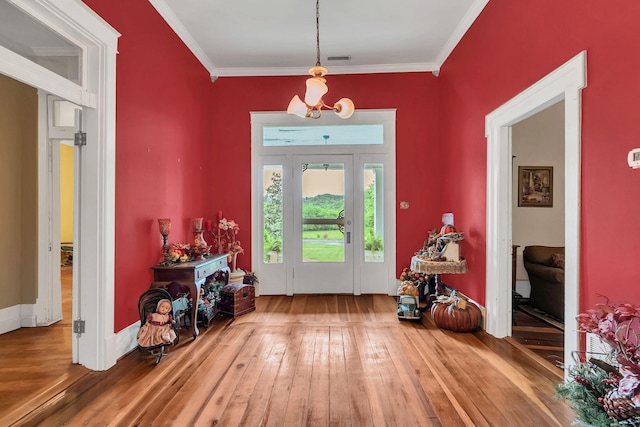 2033 Carters Creek Pike, Franklin, TN 37064 - entryway with wood-type flooring, crown molding, and a chandelier