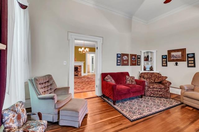2033 Carters Creek Pike, Franklin, TN 37064 - living area featuring wood finished floors, crown molding, a chandelier, a fireplace, and a ceiling fan