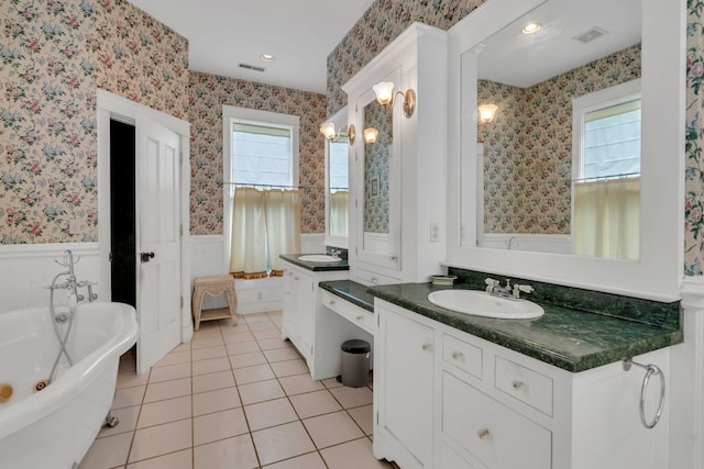 2033 Carters Creek Pike, Franklin, TN 37064 - full bath featuring wallpapered walls, a wainscoted wall, a freestanding tub, tile patterned flooring, and two vanities