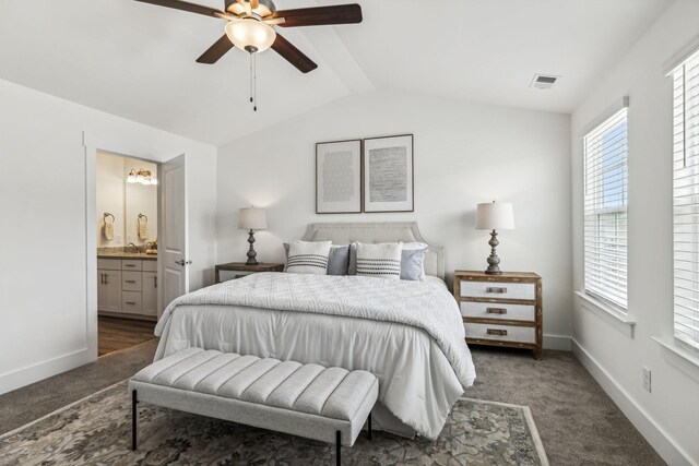 1115 Sweetleaf Dr, Franklin, TN 37064 - carpeted bedroom featuring lofted ceiling, multiple windows, connected bathroom, and baseboards