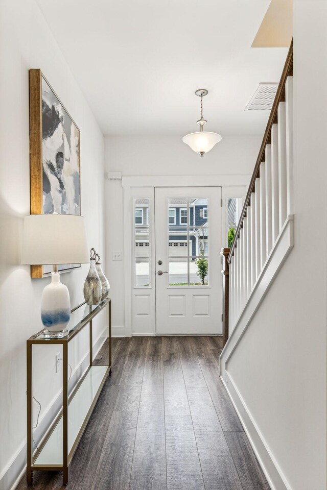 1115 Sweetleaf Dr, Franklin, TN 37064 - foyer with dark wood-style floors, stairway, and baseboards