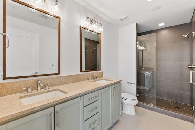 1212 Laurel St Unit 701, Nashville, TN 37203 - full bath with a stall shower, toilet, double vanity, tile patterned flooring, and recessed lighting