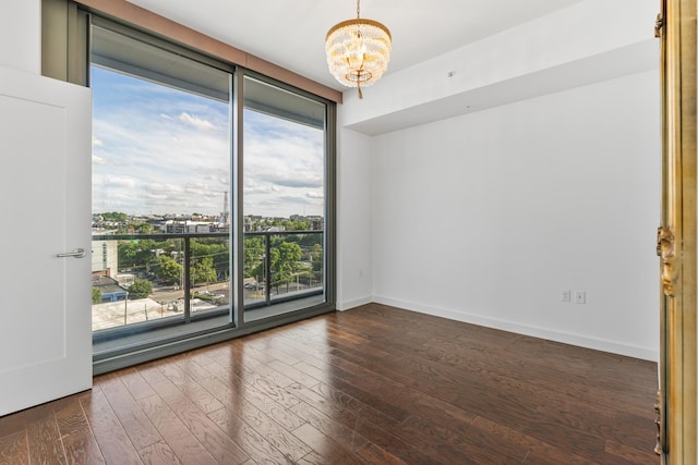 1212 Laurel St Unit 701, Nashville, TN 37203 - empty room with plenty of natural light, a chandelier, dark wood-type flooring, and floor to ceiling windows