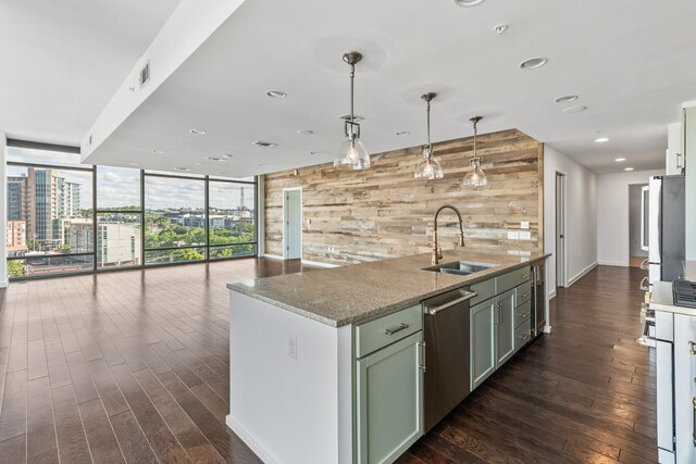 1212 Laurel St Unit 701, Nashville, TN 37203 - kitchen featuring a sink, appliances with stainless steel finishes, dark wood finished floors, a kitchen island with sink, and expansive windows