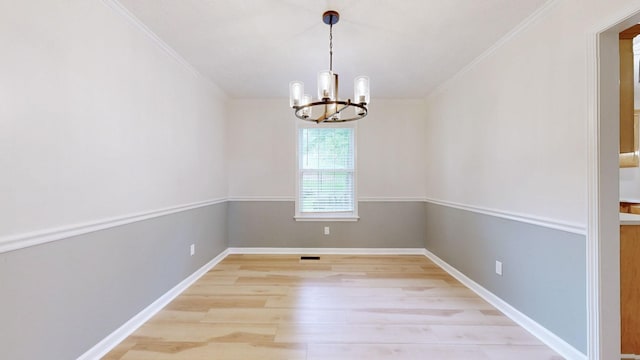 618 Cookstown Dr, Smyrna, TN 37167 - unfurnished dining area featuring a chandelier, light wood-style flooring, crown molding, and baseboards