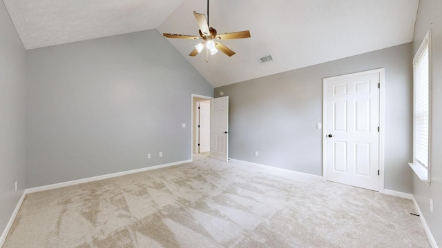 618 Cookstown Dr, Smyrna, TN 37167 - unfurnished bedroom with light colored carpet, multiple windows, baseboards, and high vaulted ceiling