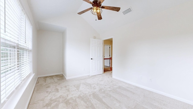 618 Cookstown Dr, Smyrna, TN 37167 - unfurnished room with plenty of natural light, light colored carpet, ceiling fan, baseboards, and high vaulted ceiling