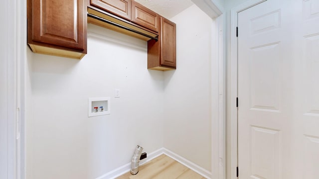 618 Cookstown Dr, Smyrna, TN 37167 - laundry room with cabinet space, hookup for a washing machine, baseboards, and light wood-type flooring