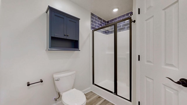 618 Cookstown Dr, Smyrna, TN 37167 - bathroom featuring toilet, a shower stall, baseboards, and wood finished floors
