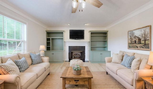 618 Cookstown Dr, Smyrna, TN 37167 - living area with a ceiling fan, wood finished floors, ornamental molding, and a fireplace