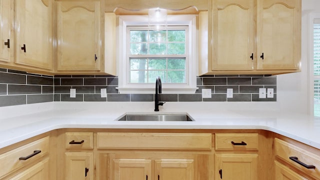 618 Cookstown Dr, Smyrna, TN 37167 - kitchen featuring a sink, light brown cabinetry, light countertops, and decorative backsplash
