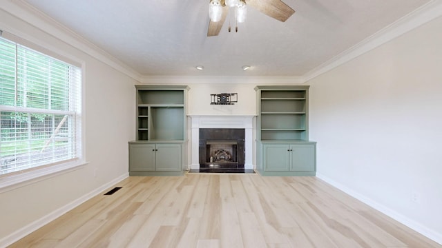 618 Cookstown Dr, Smyrna, TN 37167 - unfurnished living room featuring ceiling fan, wood finished floors, a fireplace, baseboards, and crown molding
