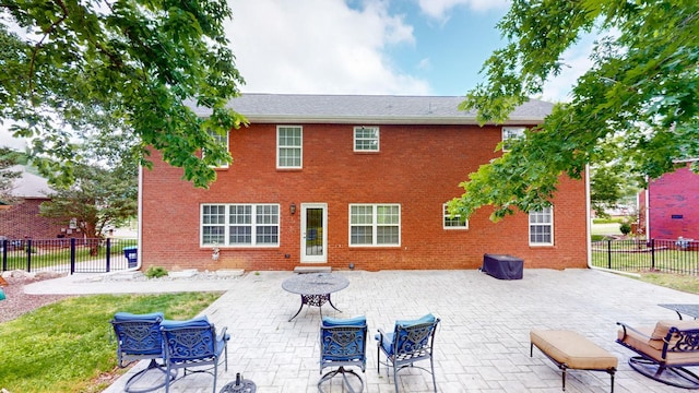 618 Cookstown Dr, Smyrna, TN 37167 - back of house featuring a patio, a fenced backyard, and brick siding