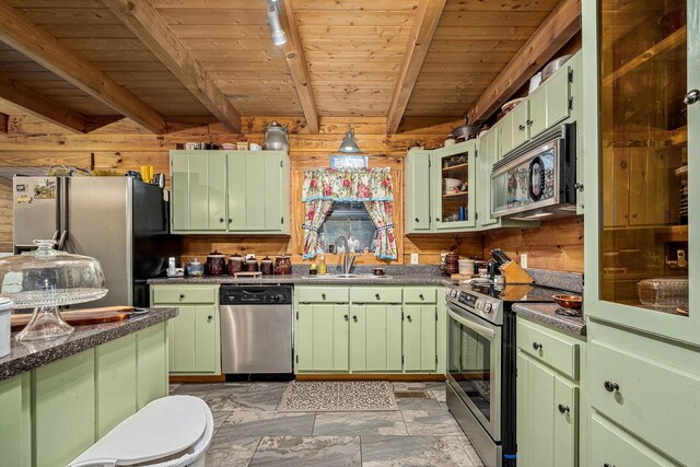 154 Whitetail Ln, Belvidere, TN 37306 - kitchen featuring appliances with stainless steel finishes, a sink, green cabinets, wooden walls, and wooden ceiling with exposed beams