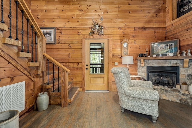 154 Whitetail Ln, Belvidere, TN 37306 - living area featuring stairway, hardwood / wood-style flooring, wooden walls, and a stone fireplace