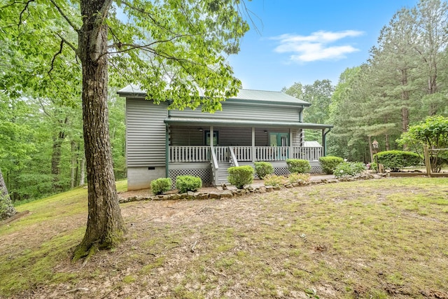 154 Whitetail Ln, Belvidere, TN 37306 - view of front facade featuring a porch, crawl space, metal roof, and a front lawn