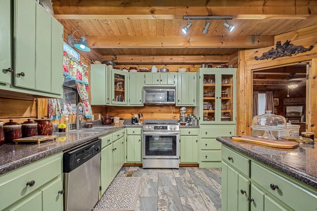 154 Whitetail Ln, Belvidere, TN 37306 - kitchen featuring stainless steel appliances, a sink, wood ceiling with exposed beams, green cabinetry, and wood walls