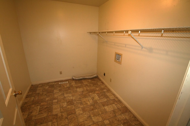 603 Canterbury Trl, Mount Juliet, TN 37122 - laundry area featuring hookup for a washing machine, baseboards, stone finish flooring, and hookup for an electric dryer