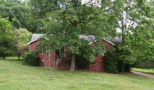 603 Canterbury Trl, Mount Juliet, TN 37122 - view of side of home featuring a lawn, brick siding, and stairway