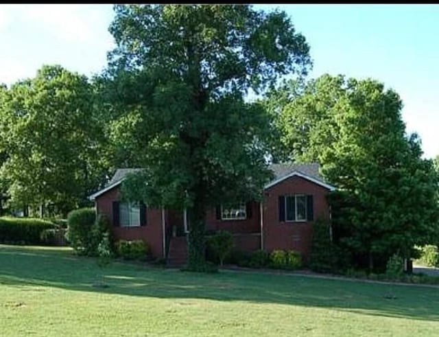 603 Canterbury Trl, Mount Juliet, TN 37122 - view of home's exterior featuring a lawn