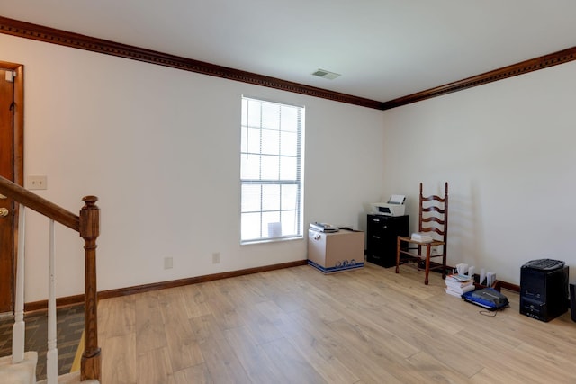 misc room featuring ornamental molding, light wood-style flooring, stairway, and baseboards