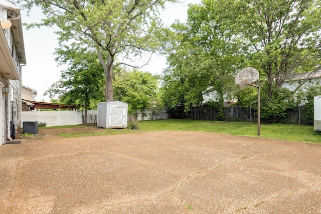 view of patio / terrace featuring central AC, a storage shed, and an outdoor structure