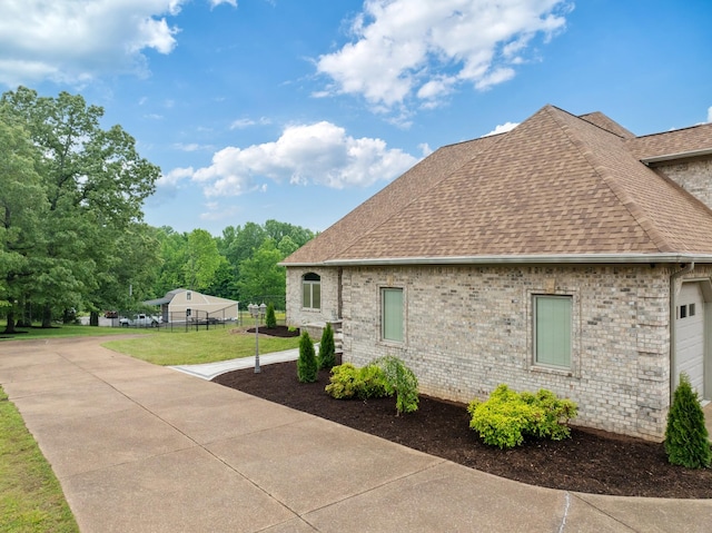 575 Homestead Ln, Henderson, TN 38340 - view of property exterior with a shingled roof and brick siding