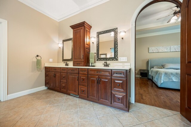 575 Homestead Ln, Henderson, TN 38340 - ensuite bathroom with crown molding, a ceiling fan, tile patterned flooring, double vanity, and baseboards