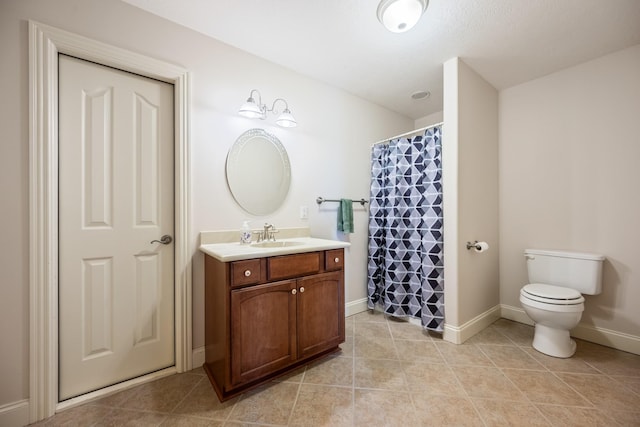 575 Homestead Ln, Henderson, TN 38340 - full bath with toilet, tile patterned flooring, baseboards, vanity, and a shower with shower curtain