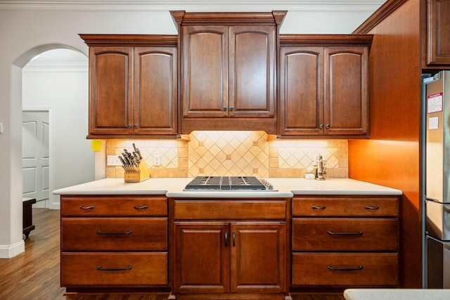 575 Homestead Ln, Henderson, TN 38340 - kitchen with light countertops, fridge, dark wood finished floors, tasteful backsplash, and crown molding