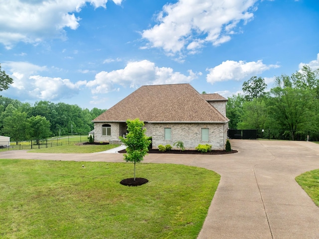 575 Homestead Ln, Henderson, TN 38340 - view of front of house with curved driveway, a shingled roof, and brick siding