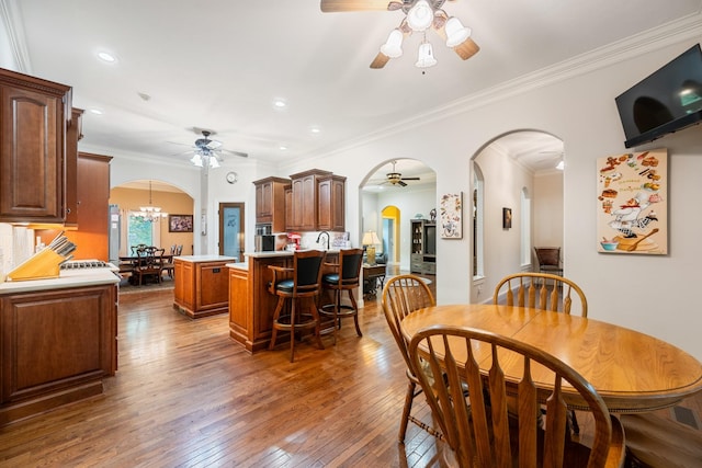 575 Homestead Ln, Henderson, TN 38340 - dining room featuring a ceiling fan, arched walkways, light wood-type flooring, a chandelier, and recessed lighting