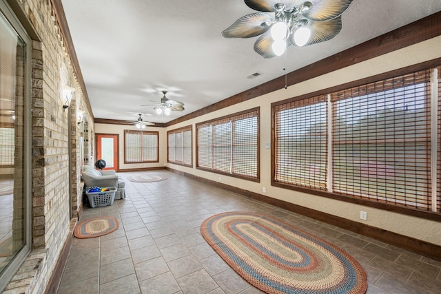 575 Homestead Ln, Henderson, TN 38340 - unfurnished sunroom featuring baseboards and tile patterned flooring