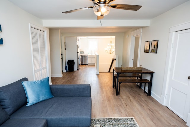 1822 Jefferson St, Nashville, TN 37208 - living room with a chandelier, light wood-type flooring, a ceiling fan, and baseboards