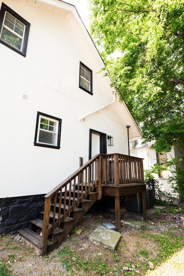 1822 Jefferson St, Nashville, TN 37208 - back of property with stucco siding, a deck, stairs, and central AC