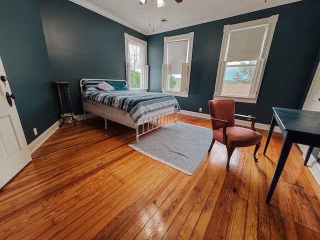 209 Main St, Cumberland City, TN 37050 - bedroom featuring hardwood / wood-style floors, crown molding, baseboards, and a ceiling fan