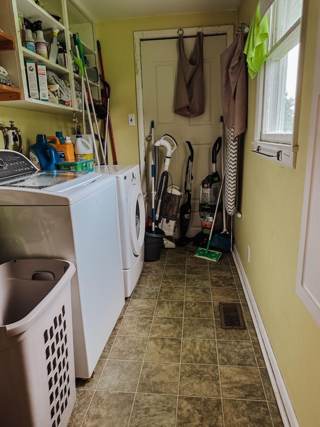 209 Main St, Cumberland City, TN 37050 - washroom with washer and dryer and stone finish floors