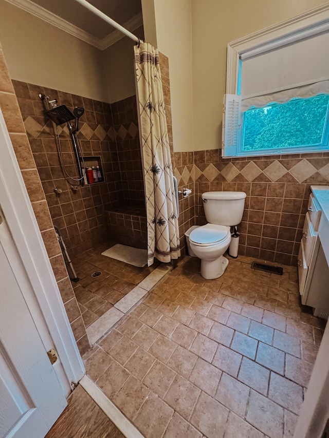 209 Main St, Cumberland City, TN 37050 - bathroom featuring ornamental molding, a shower stall, toilet, vanity, and a wainscoted wall