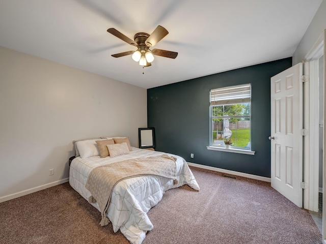 100 Oak Ave, Dickson, TN 37055 - bedroom with carpet flooring, ceiling fan, and baseboards