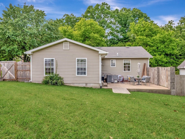 100 Oak Ave, Dickson, TN 37055 - back of house featuring a patio area, a gate, and central air condition unit