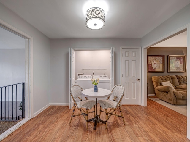 100 Oak Ave, Dickson, TN 37055 - dining room with washer and dryer, light wood-style flooring, and baseboards