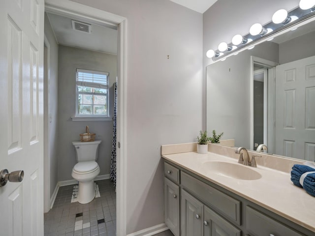 100 Oak Ave, Dickson, TN 37055 - bathroom with tile patterned flooring, vanity, baseboards, and toilet