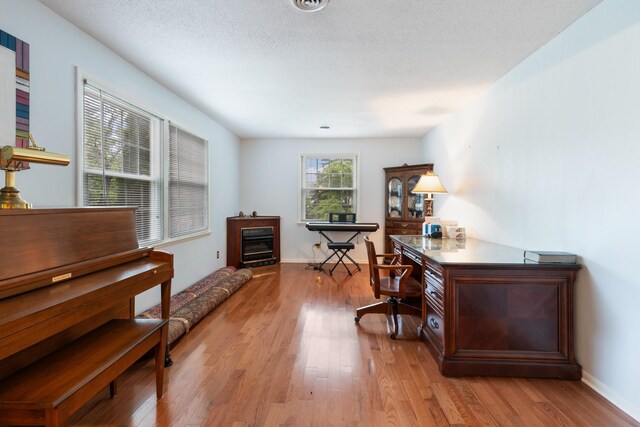 103 Forrest Hills Dr, Dickson, TN 37055 - office area featuring light wood-type flooring, a fireplace, and baseboards