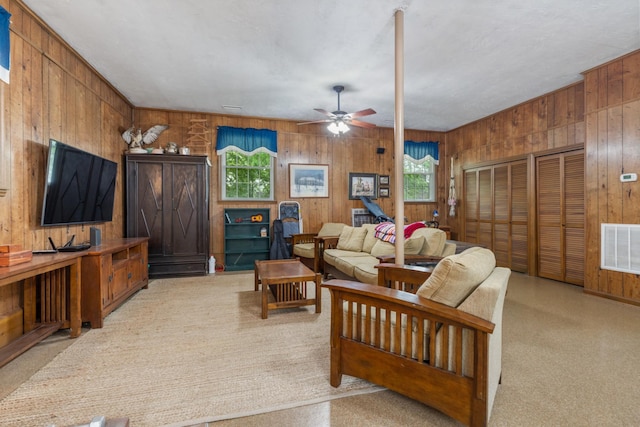 103 Forrest Hills Dr, Dickson, TN 37055 - living area featuring wood walls, healthy amount of natural light, and a ceiling fan