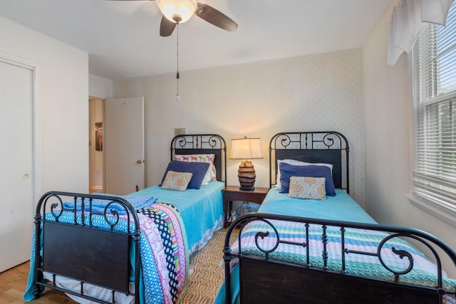 103 Forrest Hills Dr, Dickson, TN 37055 - bedroom with wallpapered walls, wood finished floors, and a ceiling fan
