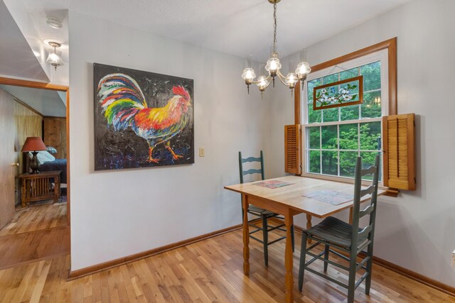 103 Forrest Hills Dr, Dickson, TN 37055 - dining space with a chandelier, wood finished floors, healthy amount of natural light, and baseboards