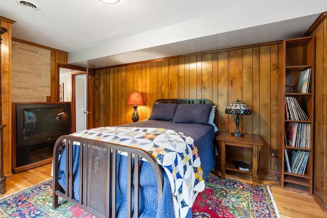 103 Forrest Hills Dr, Dickson, TN 37055 - bedroom featuring light wood-type flooring and wooden walls