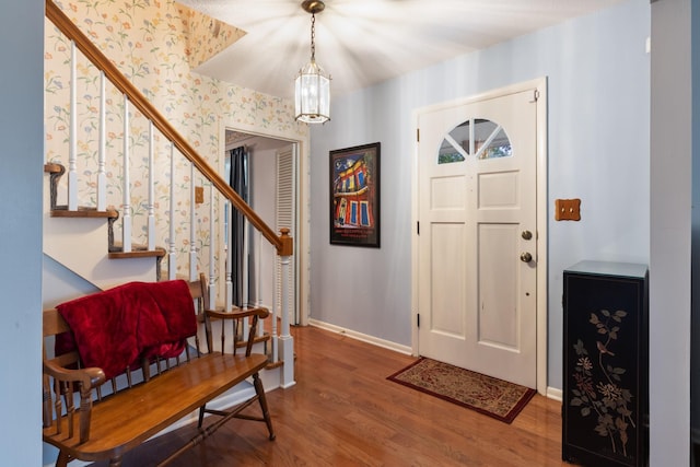 103 Forrest Hills Dr, Dickson, TN 37055 - foyer entrance with wood finished floors, stairway, baseboards, wallpapered walls, and a chandelier
